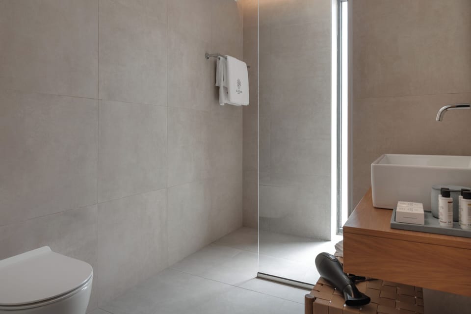 Supreme Suite Sea View Jetted Tub | Bathroom | Shower, designer toiletries, hair dryer, bathrobes