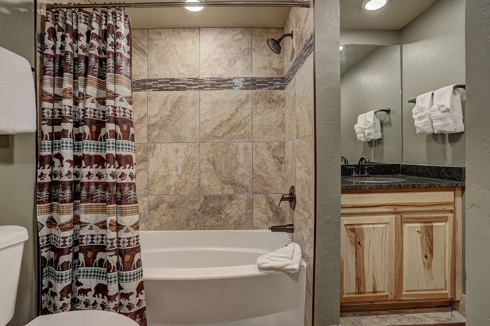 2nd bathroom on 2nd level feature shower/tub combo.