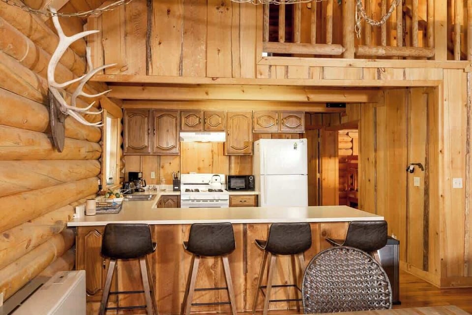 Kitchen with a breakfast bar.