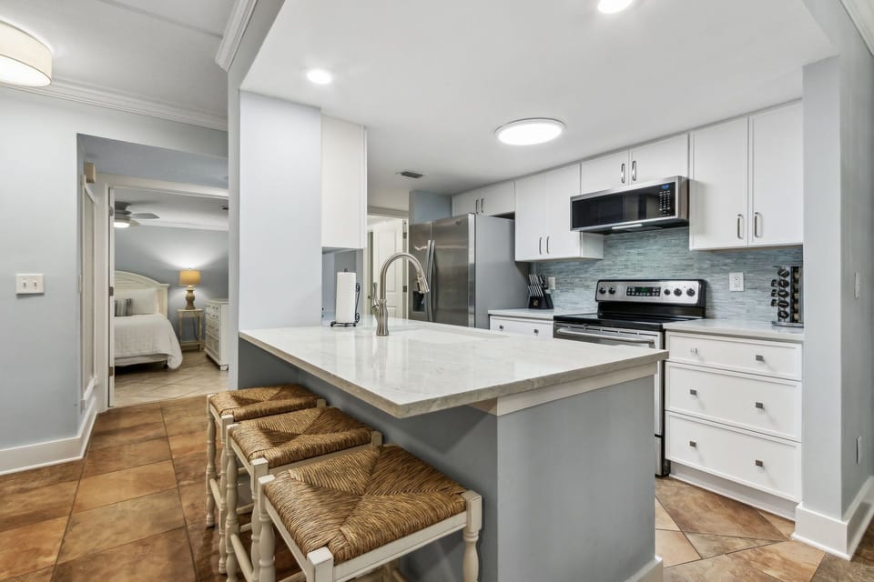Updated Kitchen with Granite Countertops and Stainless Steel Appliances with Counter Seating for 3