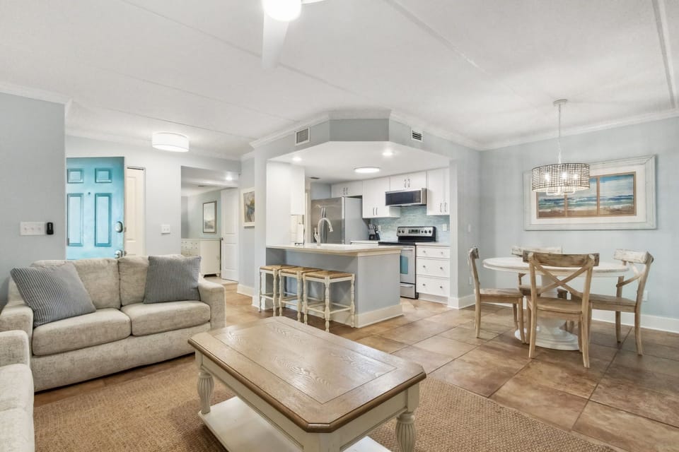 Living Area with Flat Screen TV and Sliding Glass Doors to Covered Patio