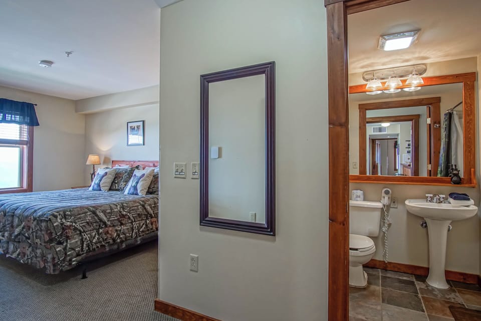 Primary bedroom with a king bed and full bathroom