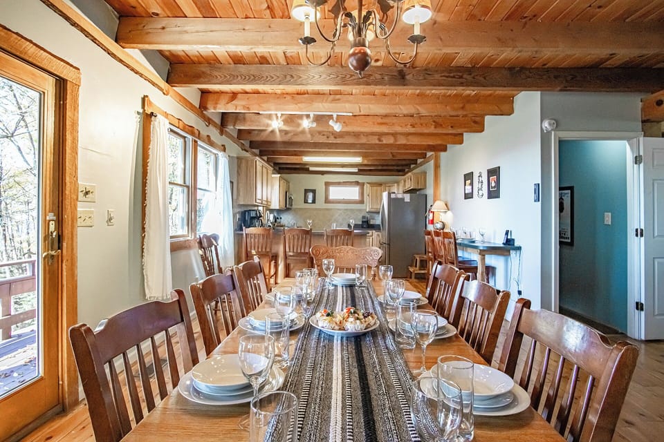 Dining table on main level seat 8 with bar settings for 6 additional people.