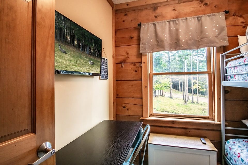 This bedroom is located on the 2nd floor and consists of a set of twin bunk beds.