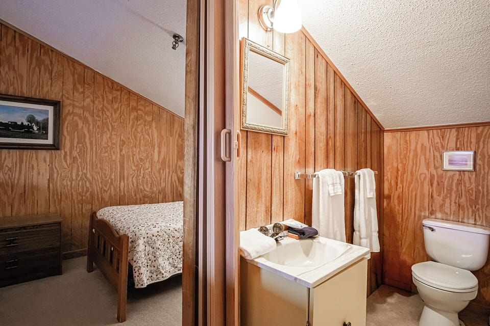 Shared half bath on the second floor for the twin bedroom and full bedroom.