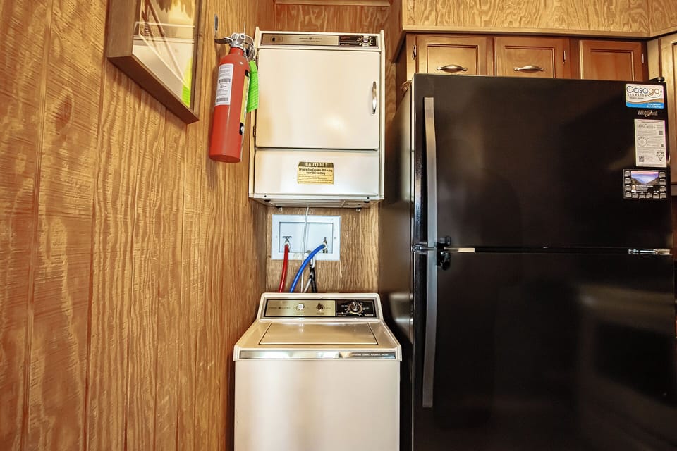 The washer and dryer are located in the kitchen.