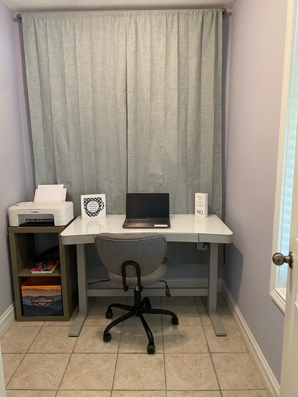 Quiet workspace, adjustable height desk.