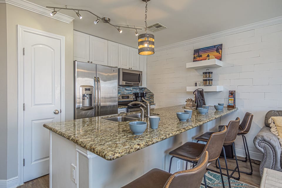 Fully stocked kitchen with all the tools to make dining in easy.