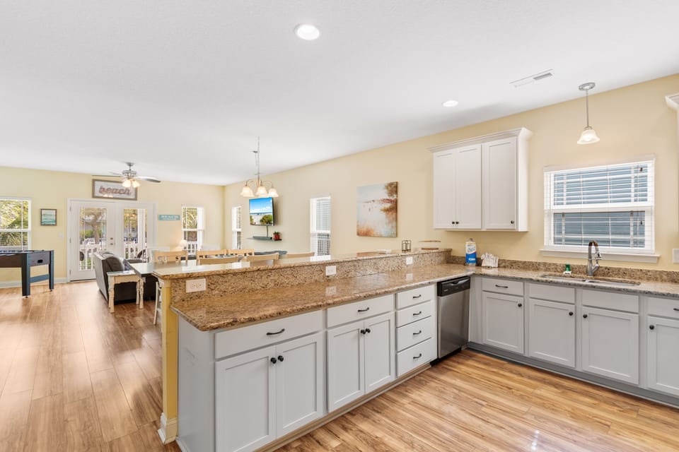 Your spacious kitchen flows seamlessly into the dining area, featuring granite countertops and modern appliances for memorable meal prep.