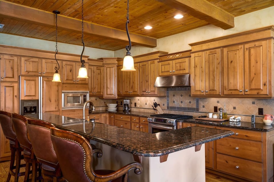 Spacious fully supplied kitchen with tons of cabinet and counter space.