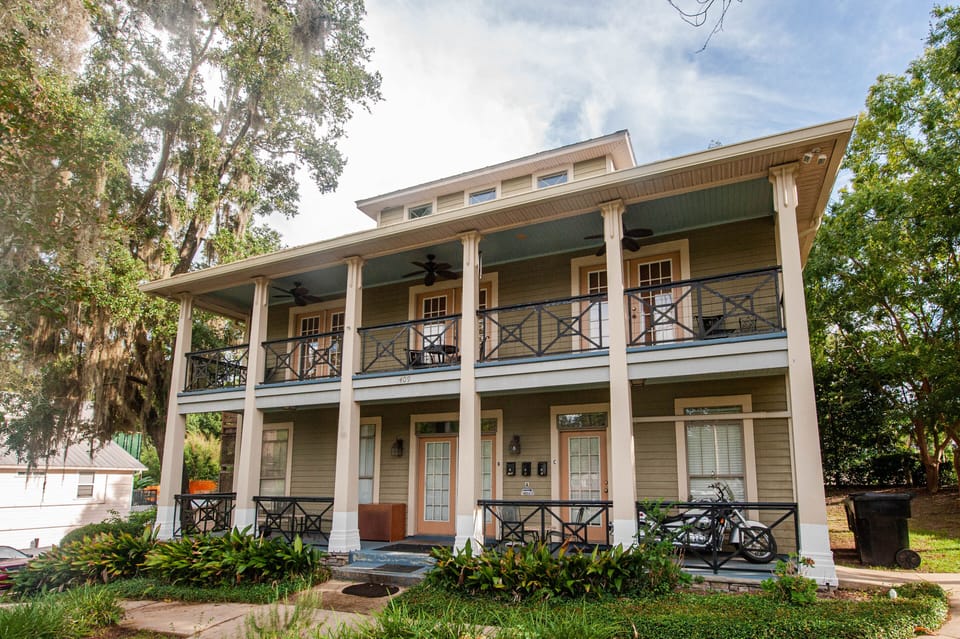 Unit is the top 2 stories with door located in the rear of the building