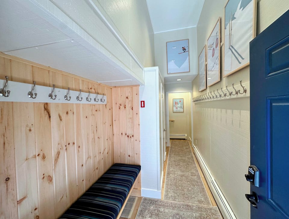 Entry area with bench and half bath