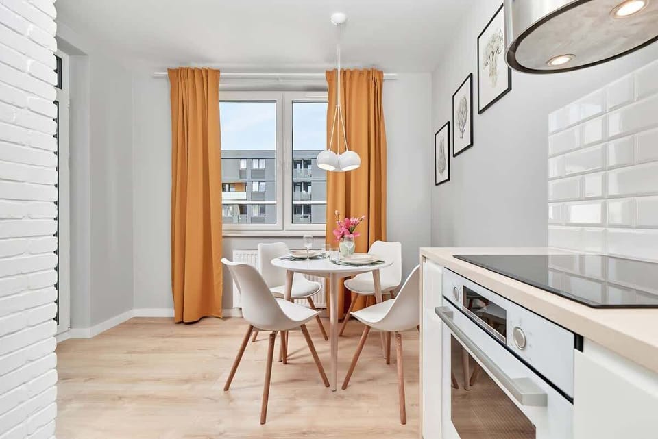 Kitchenette with oven and refrigerator. 