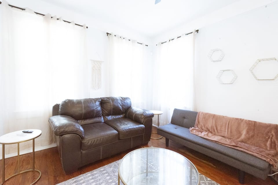 The living Room has a sleeper sofa and smart TV.