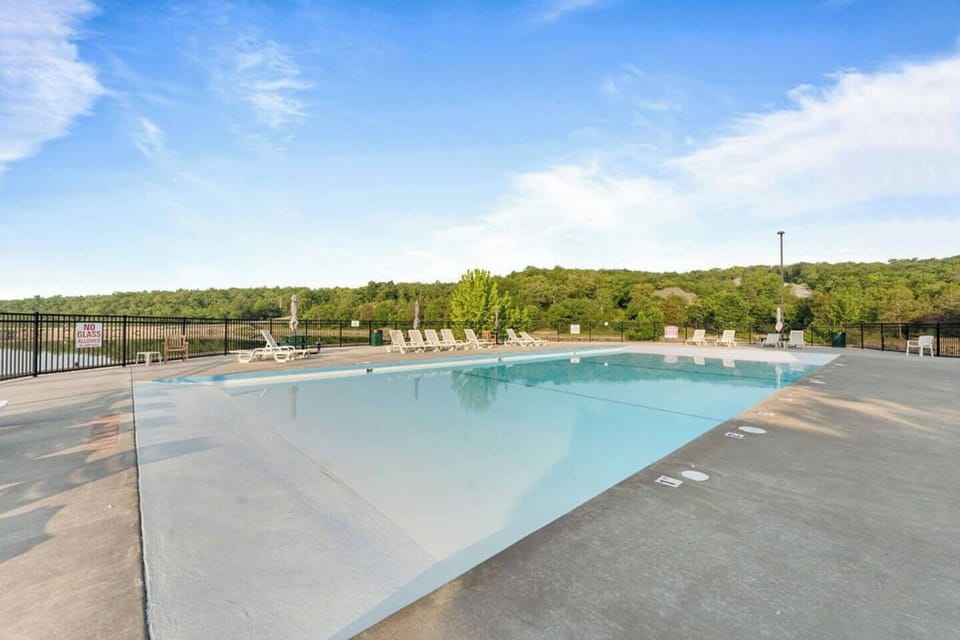 The main large pool is a zero-entry pool right on the private lake and walking distance from the cabin