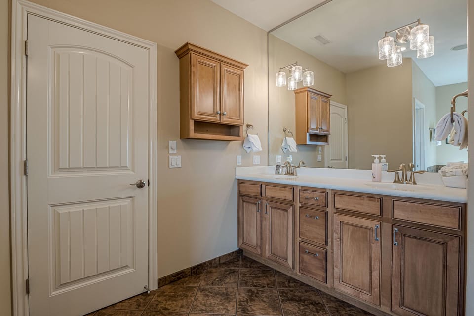 Elegant and spacious, this master bathroom offers a calming atmosphere with sleek, modern design.