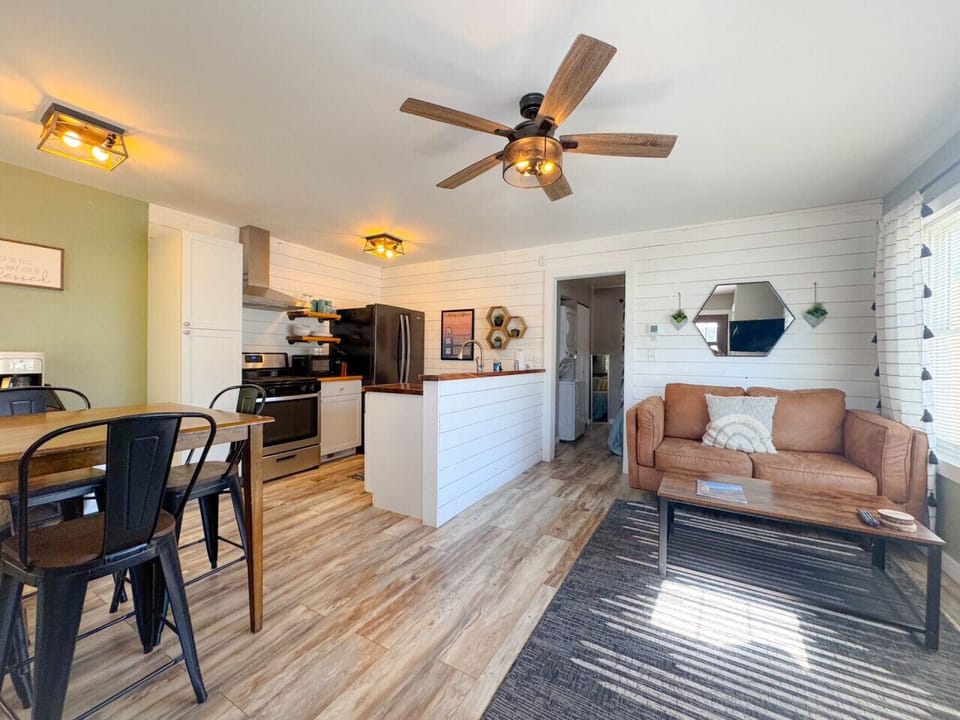 Modern updated apartment with open kitchen, living, dining and separate bedroom with attached bathroom. Unit includes laundry and is fully stocked to serve as your home base in the Black Hills!