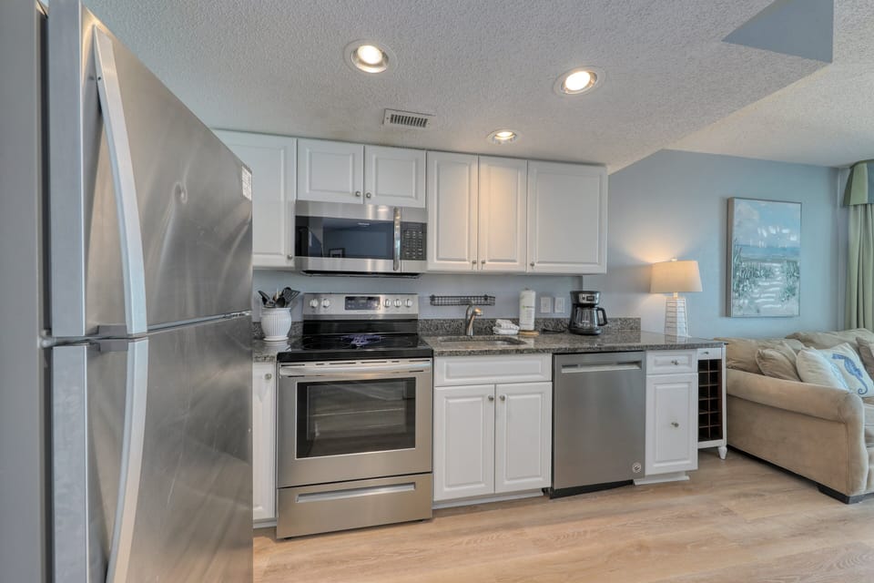 Stainless steel appliances with a beautiful granite countertop