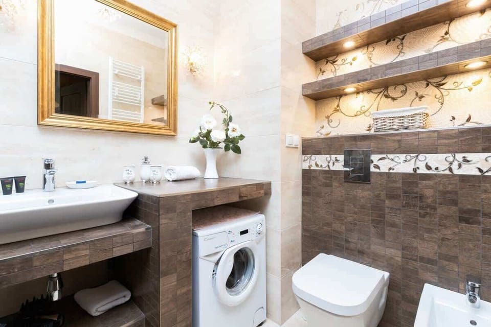 A close-up of the bathroom sink area with elegant lighting and a minimalist design.
