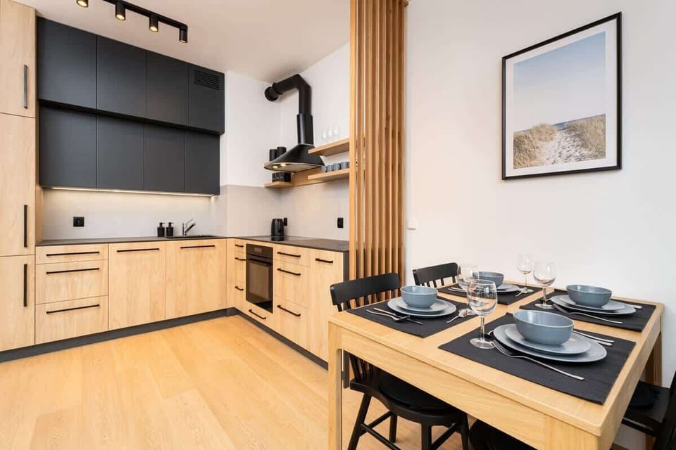 The sleek design of the kitchenette blending seamlessly with the living area.