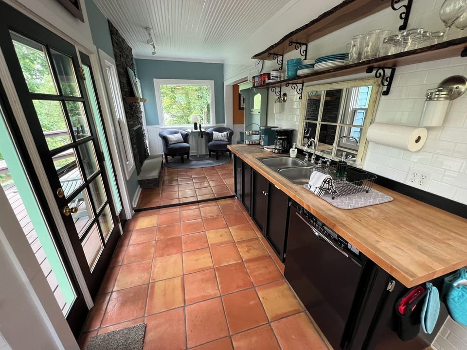 The kitchen has a new Bosch dishwasher for your convenience.
