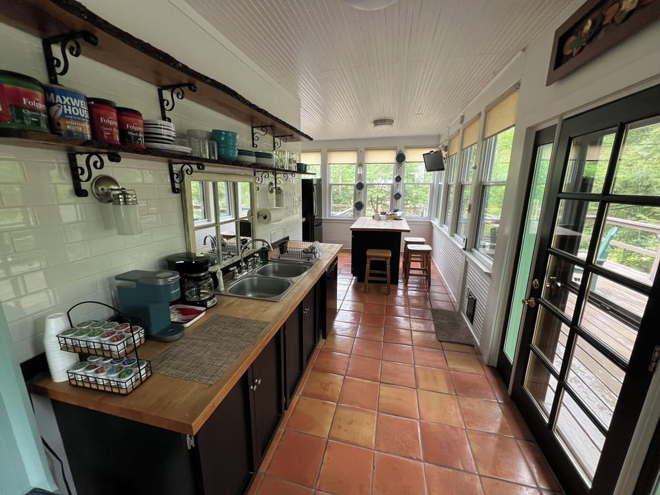 View from fireplace area looking towards the kitchen area.