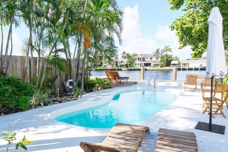 shared heated pool, patio, dock and BBQ overlooking intracoastal waterway