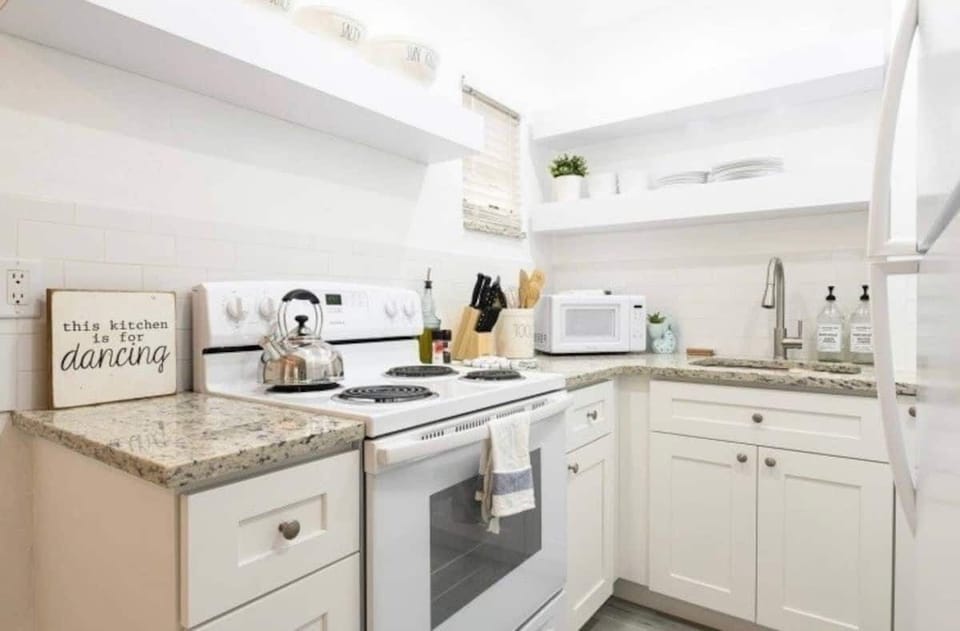 fully stocked kitchen with all appliances for gourmet cooking