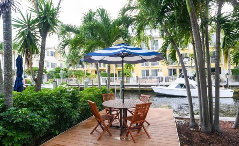 Private balcony overlooking a serene waterfront canal