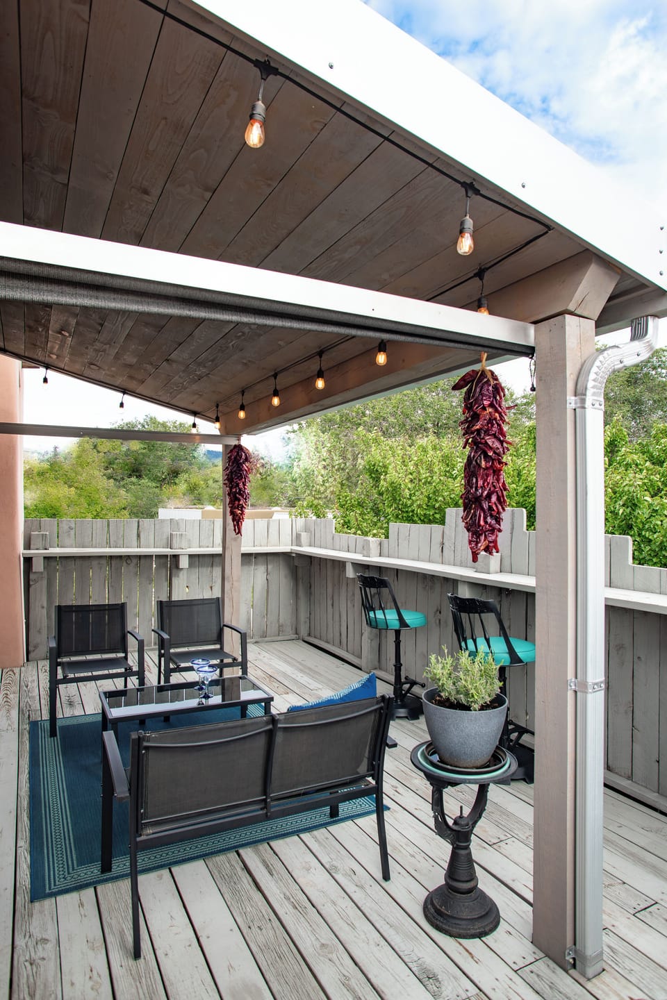 Lighted 2nd level balcony with tree top views.