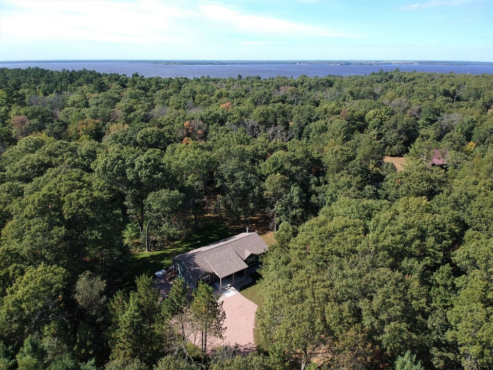 5 acre wooded lot with large grassy yard