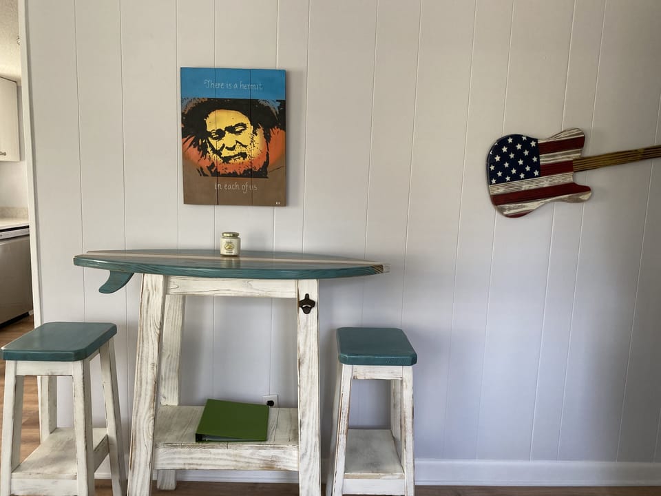 Local Artists accentuate the vibe of this cozy bungalow.
