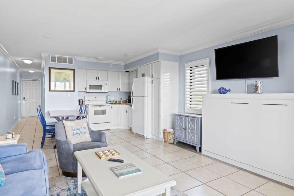 Windows in living room overlooking adjacent channel, large fully equipped kitchen