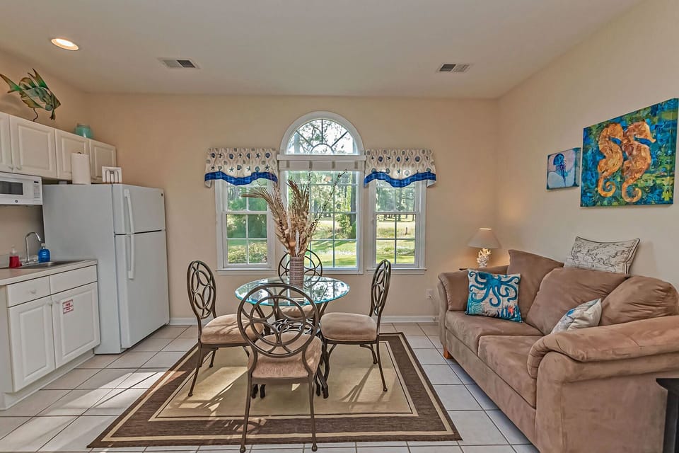Mini Suite -- Living Area with Love Seat and table for 4