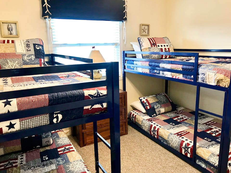 Third bedroom with two sets of bunk beds and private bath