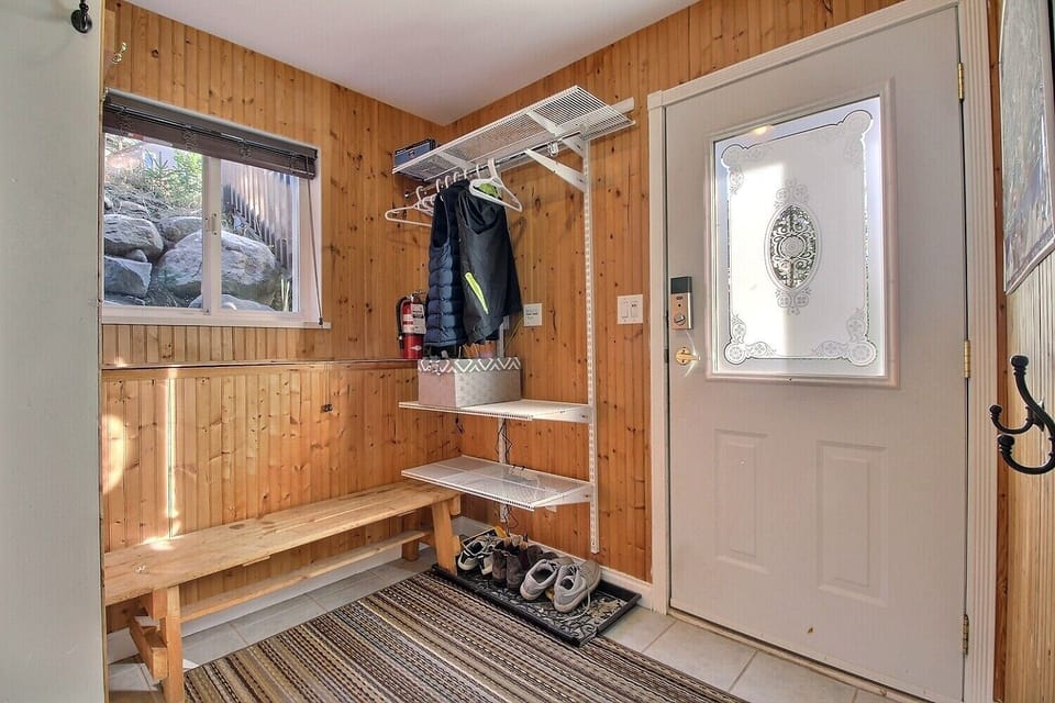 Awesome mud room perfect for all your gear with plenty of hooks, seating bench, 