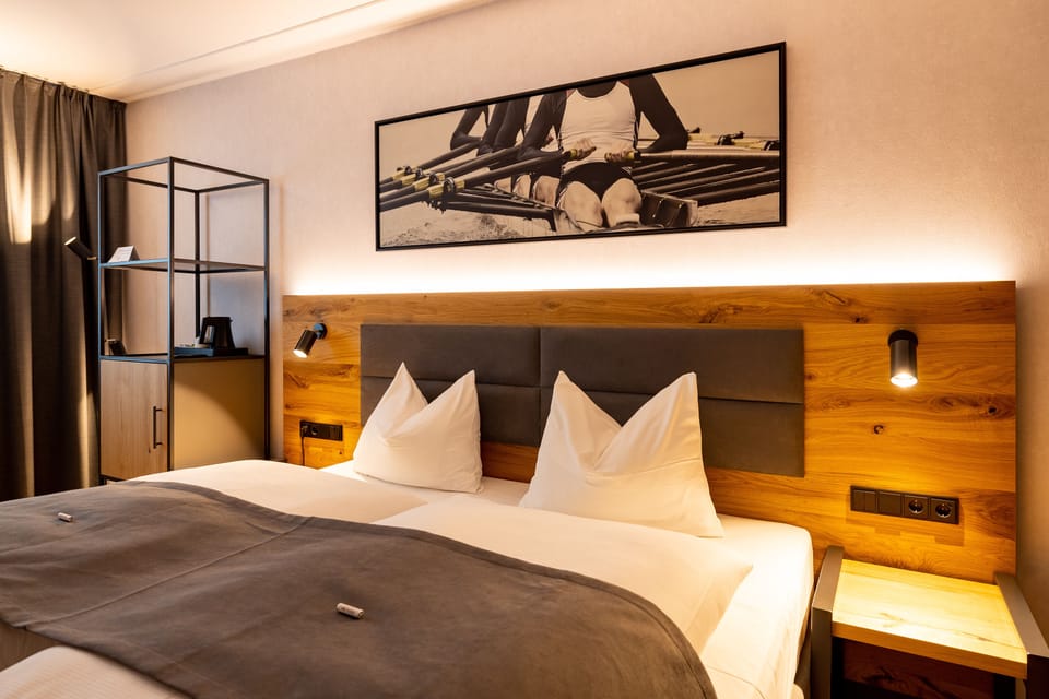 Premium bedding, desk, laptop workspace, blackout drapes