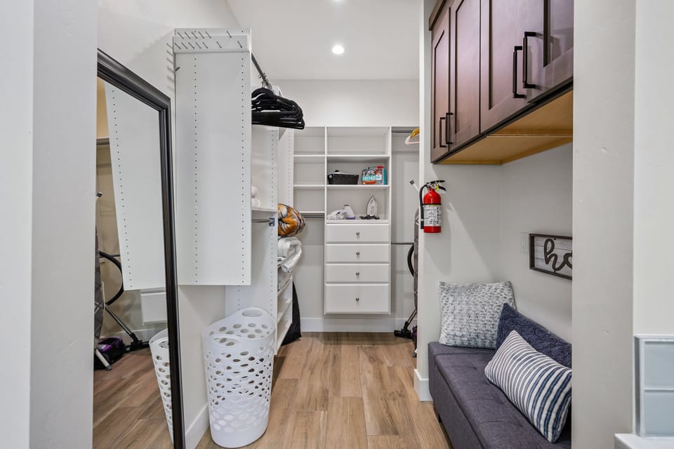 Walk-in closet.  Includes iron, ironing board, and steam iron.  