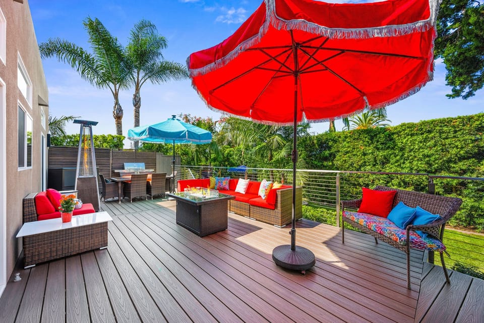 Outdoor Lounge Deck, connecting both homes; includes lounge seating, fire table, patio heater, BBQ, umbrellas