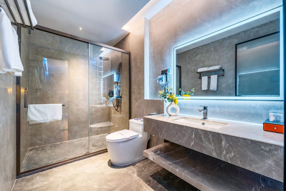 Shower, rainfall showerhead, designer toiletries, hair dryer