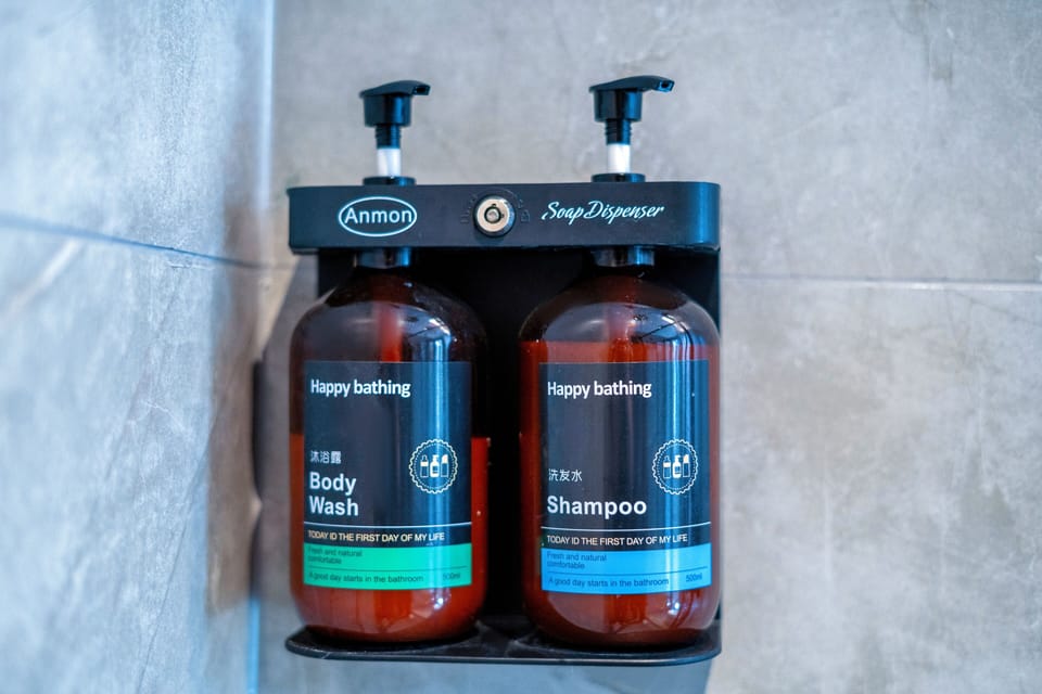 Shower, rainfall showerhead, designer toiletries, hair dryer