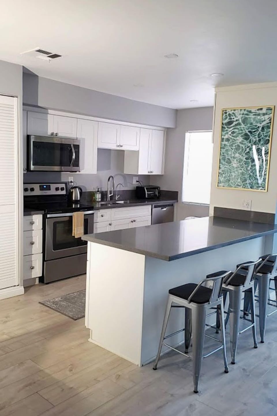 4 more can sit at kitchen island