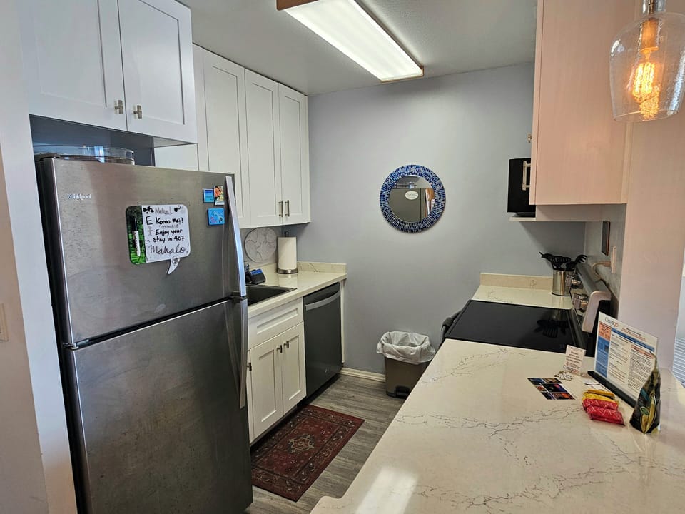 The kitchen includes newly installed appliances and thoughtful touches that make meal prep easy for long or short stays.
