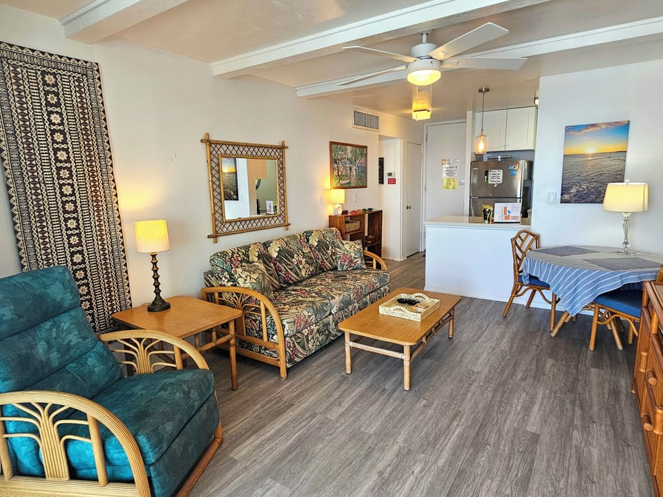 Step into your top-floor retreat with sweeping, unobstructed ocean views from the living room. Comfortable seating, cool central A/C, and modern décor create the perfect place to relax and unwind.