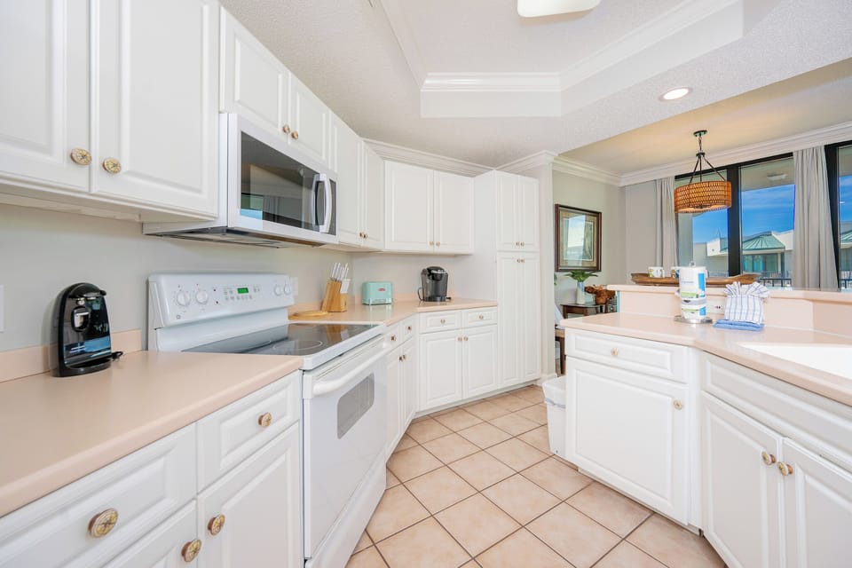 Create delightful meals in this inviting kitchen, complete with a Keurig coffee maker and coastal charm