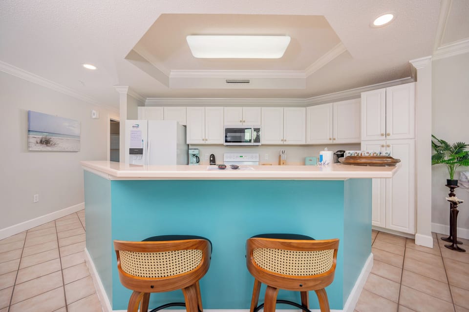 Sip your morning coffee at the breakfast bar and get ready for a day of adventure in this stylish space