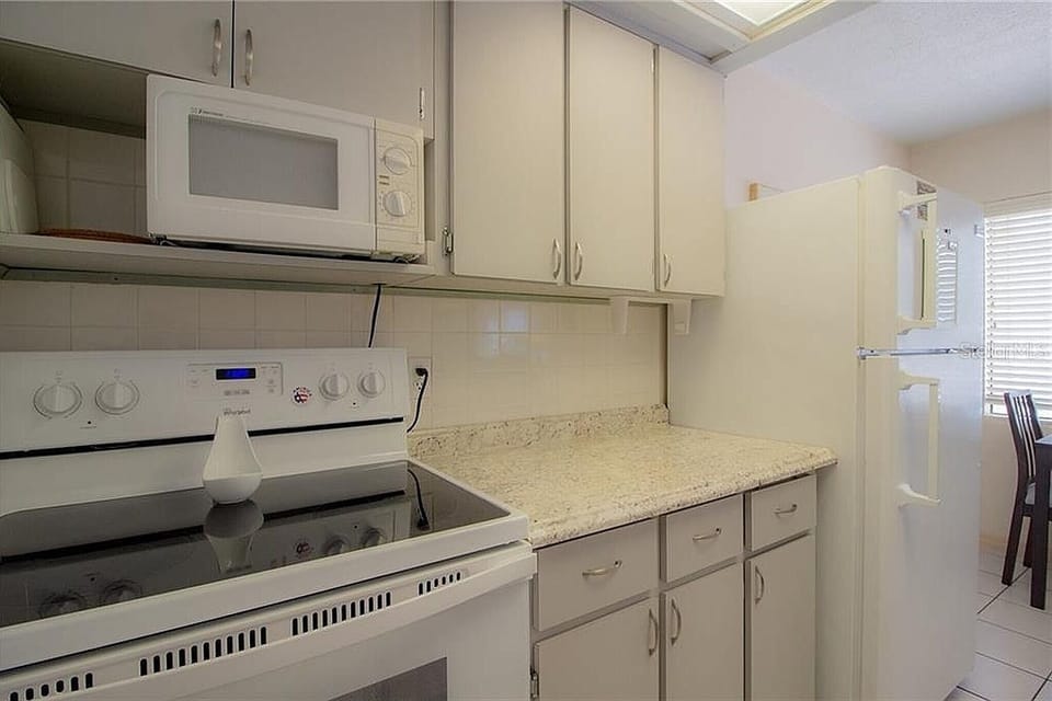 full size kitchen with pots, pans, plates, coffee pot etc. everything included.