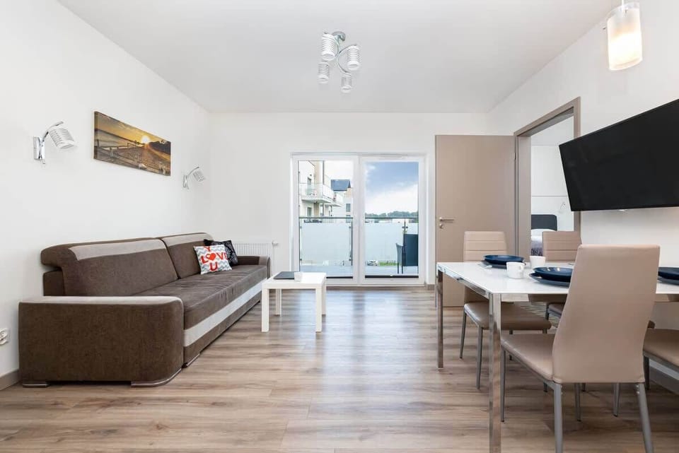 Living room of Pięć Mórz Lotnicza 1I/20 apartment with sofa
