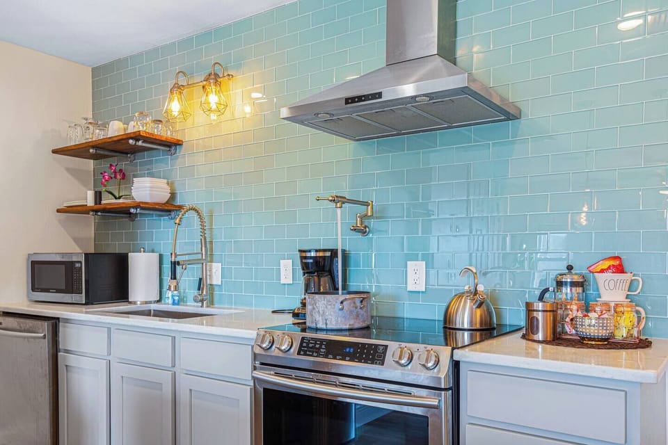 Fully loaded kitchen, complete with pot filler makes life easier...I use it to fill the coffee pot too. Kitchen is small, but well equipped.
