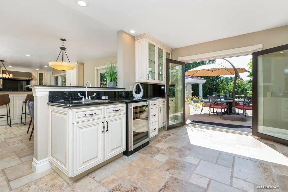 Main Level: Between kitchen and living room, wet bar.